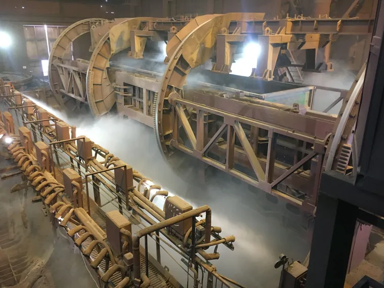 Dust suppression fog along rotary wagon tippers, steel works