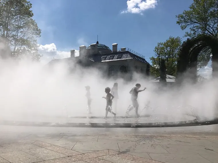 Children playing in fog at a dry fountain, Peterhof, Saint Petersburg